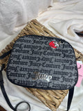 Bolsa Juicy Couture Negra con charm en forma de 🍓